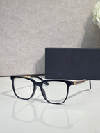 Dior glasses with dark blue frames and clear lenses