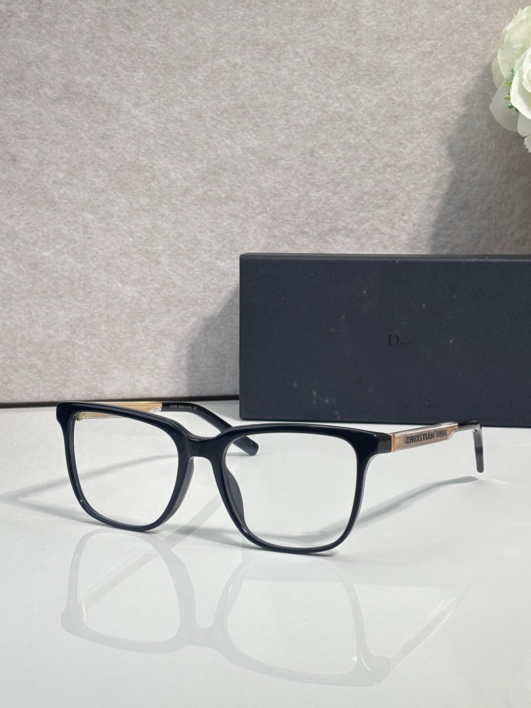 Dior glasses with dark blue frames and clear lenses