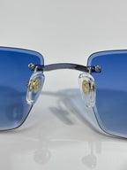 Blue lens sunglasses with clear frame and round metal details