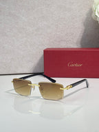 Gold sunglasses with light amber square lenses and black temple tips