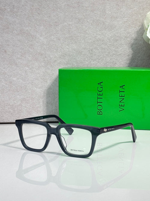 Bottega Veneta eyeglasses with dark blue square frames and clear lenses, side view