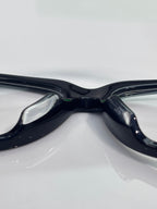 Bottega Veneta eyeglasses close-up, dark glossy frame with clear lenses