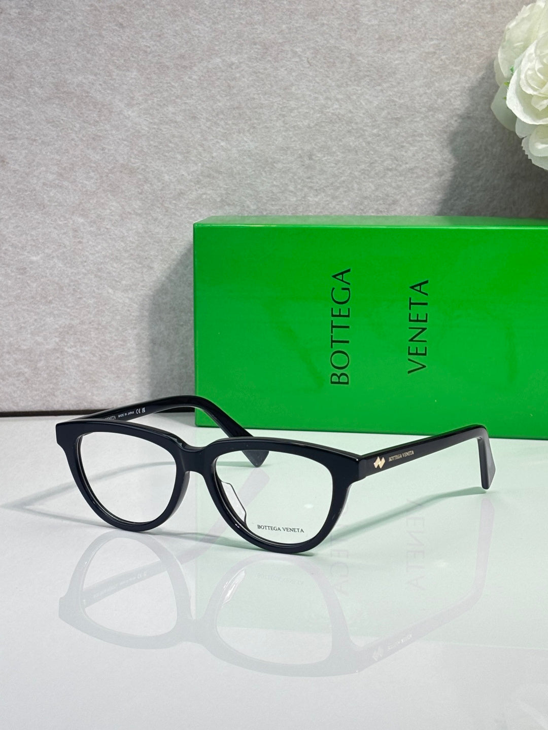 Bottega Veneta eyeglasses, dark frame with clear lenses, side view
