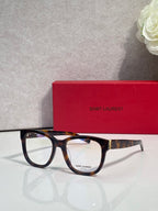 Saint Laurent eyeglasses with tortoise frame and gold logo accents, front view