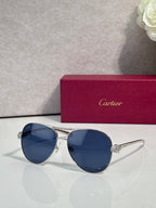 Cartier sunglasses with blue tinted lenses and silver-tone cat-eye frames, side detail