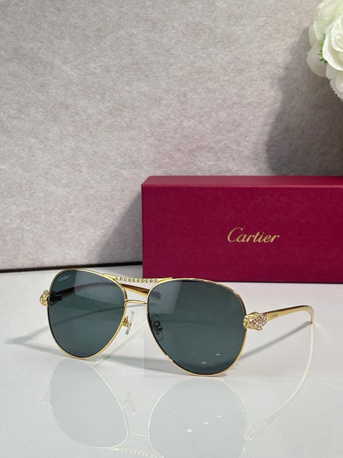 Cartier sunglasses with dark teal tinted lenses and gold-tone cat-eye frames, side detail