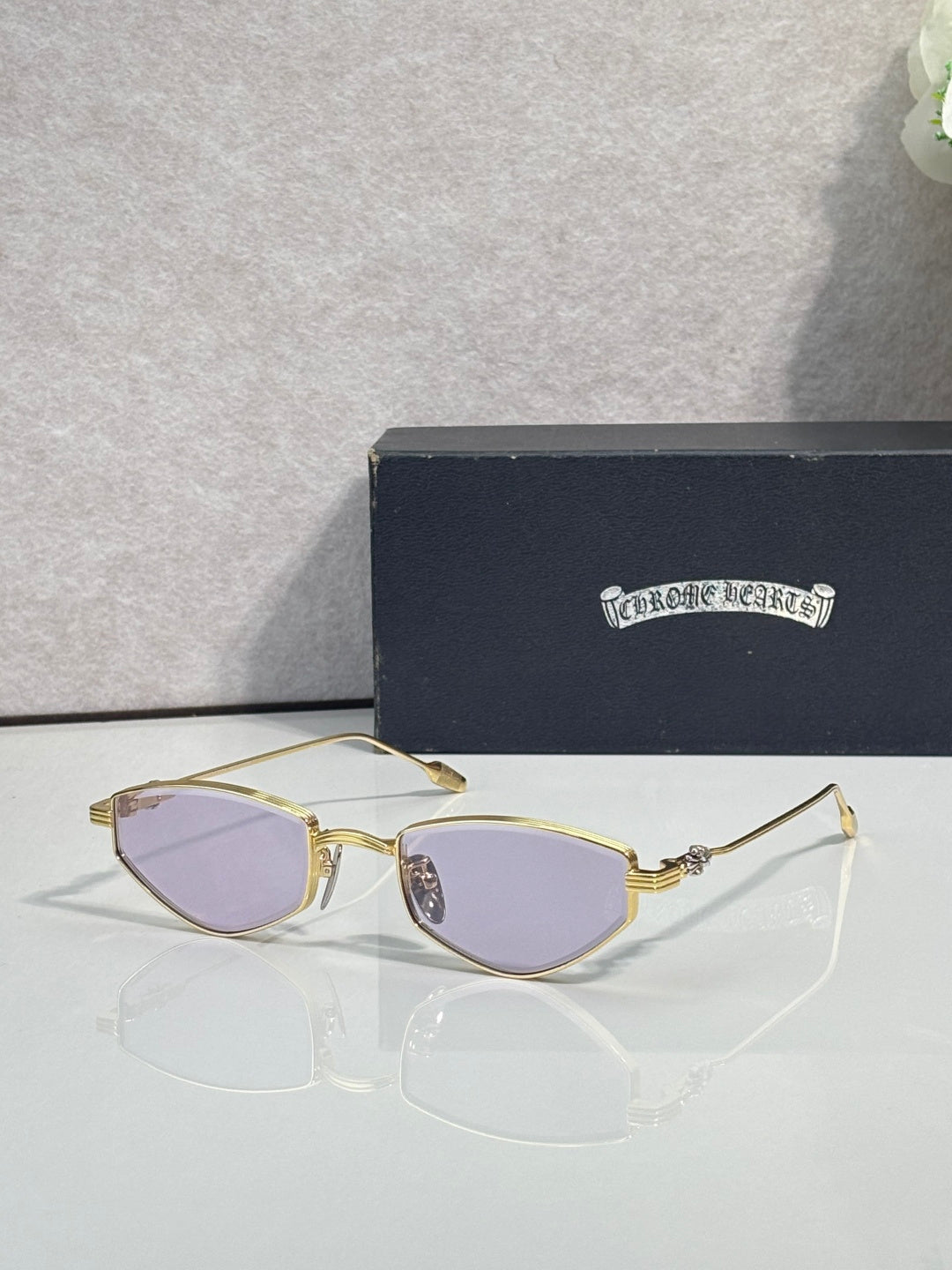 Gold-tone metal glasses with lavender lenses and gold metal frames