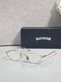 Gold-tone metal glasses with clear lenses and thin curved rims