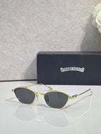 Gold metal frame sunglasses with gray-tinted round lenses and clear ear pieces