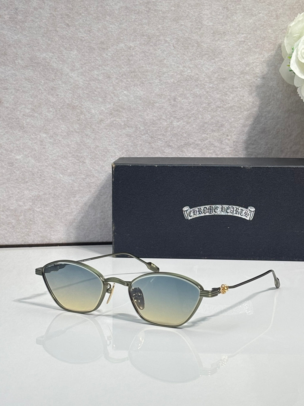 Gold metal frame sunglasses with gradient yellow lenses and clear temple arms