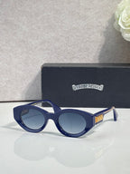 Blue round-frame glasses with tinted lenses and gold detail on temple
