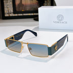 Versace sunglasses with gold frames and dark tinted lenses, blue inner temple detail