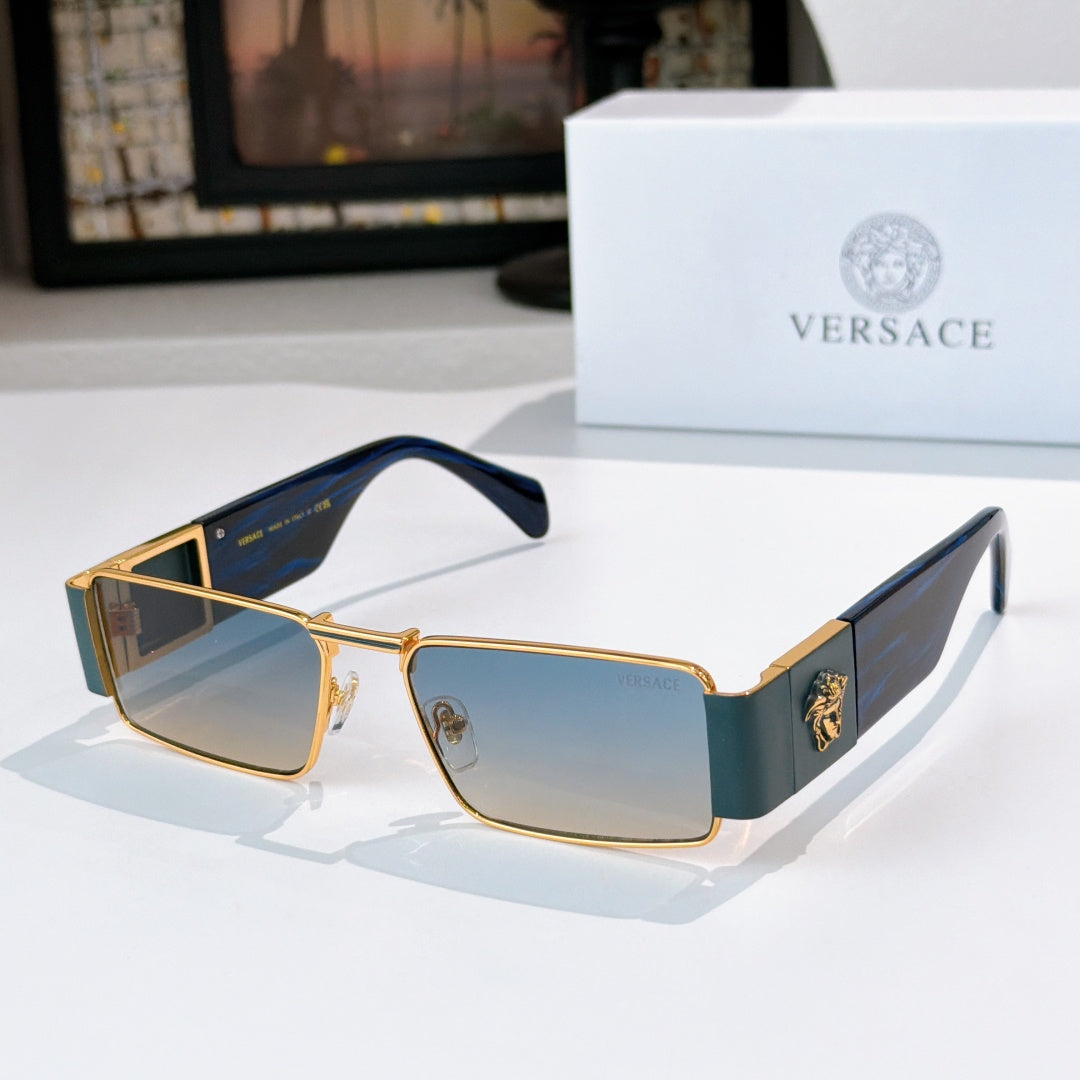Versace sunglasses with gold frames and dark tinted lenses, blue inner temple detail