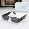 Versace sunglasses with black frames and dark tinted lenses, silver logo on temple