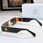 Versace sunglasses with gold frames and dark tinted lenses, black temple with emblem