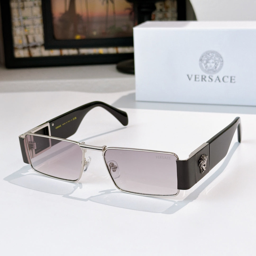 Versace sunglasses with silver frames and light tinted lenses, black temple accents