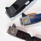 Versace sunglasses showing temple emblems and lens colors in a flat lay
