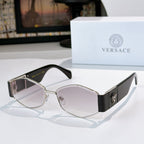 Cat-eye sunglasses with silver-tone frame, dark lenses, and black temples with logo detail.