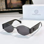 Cat-eye sunglasses with black frame and gray lenses, black temples with logo detail.