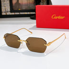 Gold cat-eye sunglasses with brown tinted lenses and ornate metal temple details.