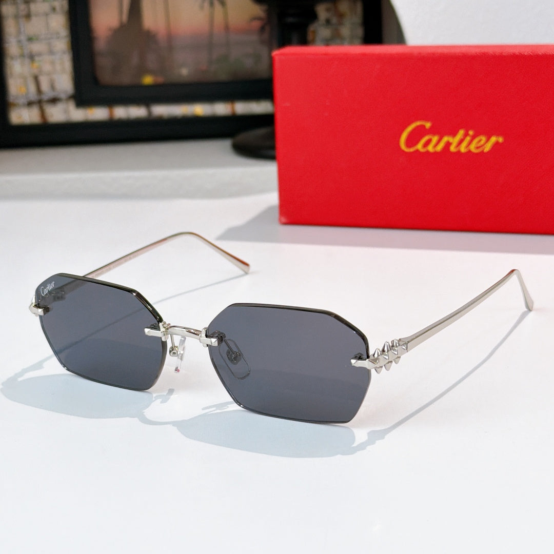 Silver cat-eye sunglasses with dark gray tinted lenses and decorative metal temples.