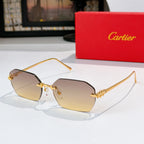 Gold cat-eye sunglasses with light brown tinted lenses and ornate metal frame details.