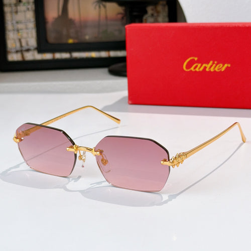 Gold cat-eye sunglasses with pink tinted lenses and ornate temple details.