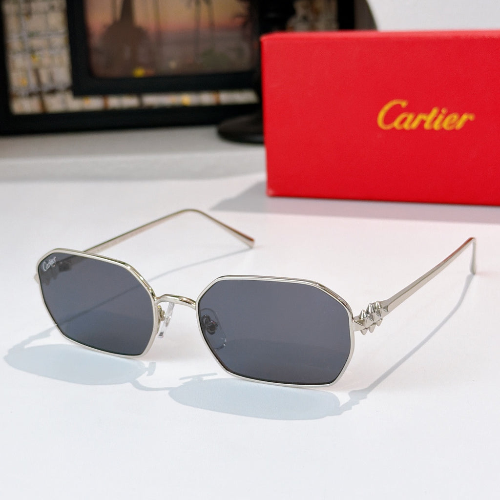 Gold-tone sunglasses with dark blue tinted lenses and angular frames