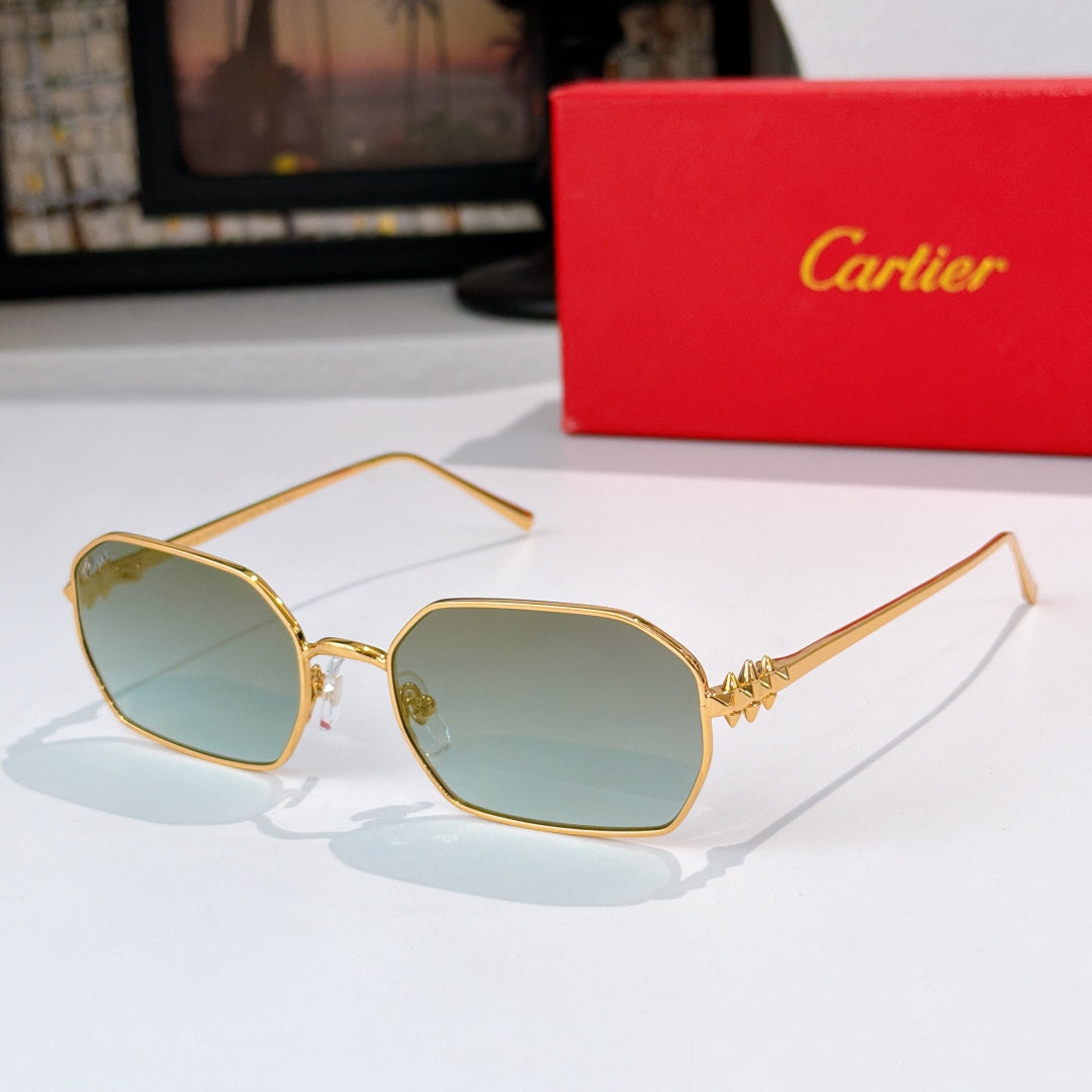 Gold-tone sunglasses with teal tinted lenses and angular frames