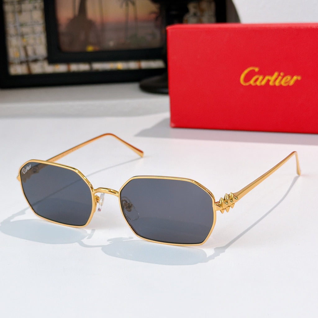 Gold-tone sunglasses with dark gray tinted lenses and angular frames