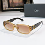 Dior sunglasses with gold frames and light brown gradient lenses