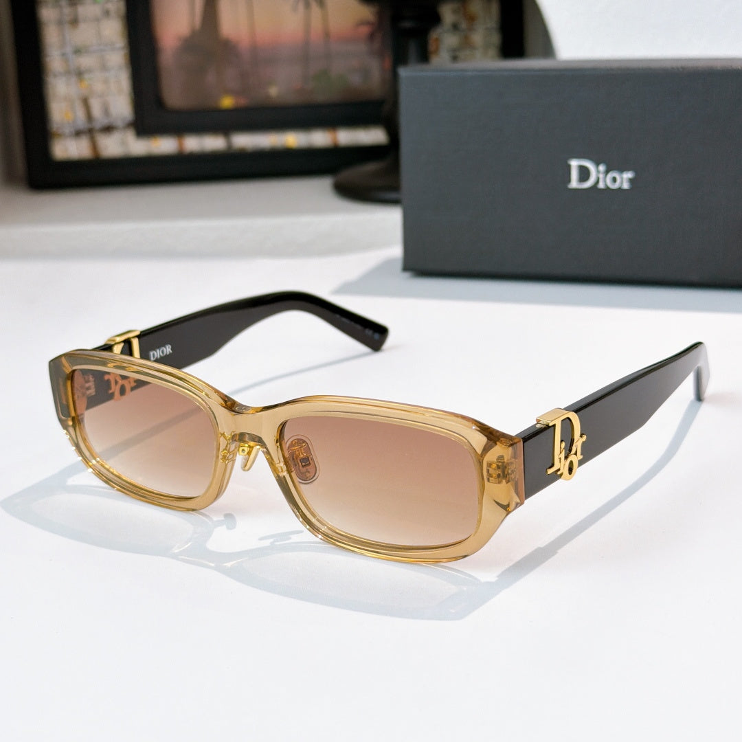 Dior sunglasses with gold frames and light brown gradient lenses
