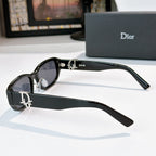 Dior sunglasses side view with black frames and dark gradient lenses