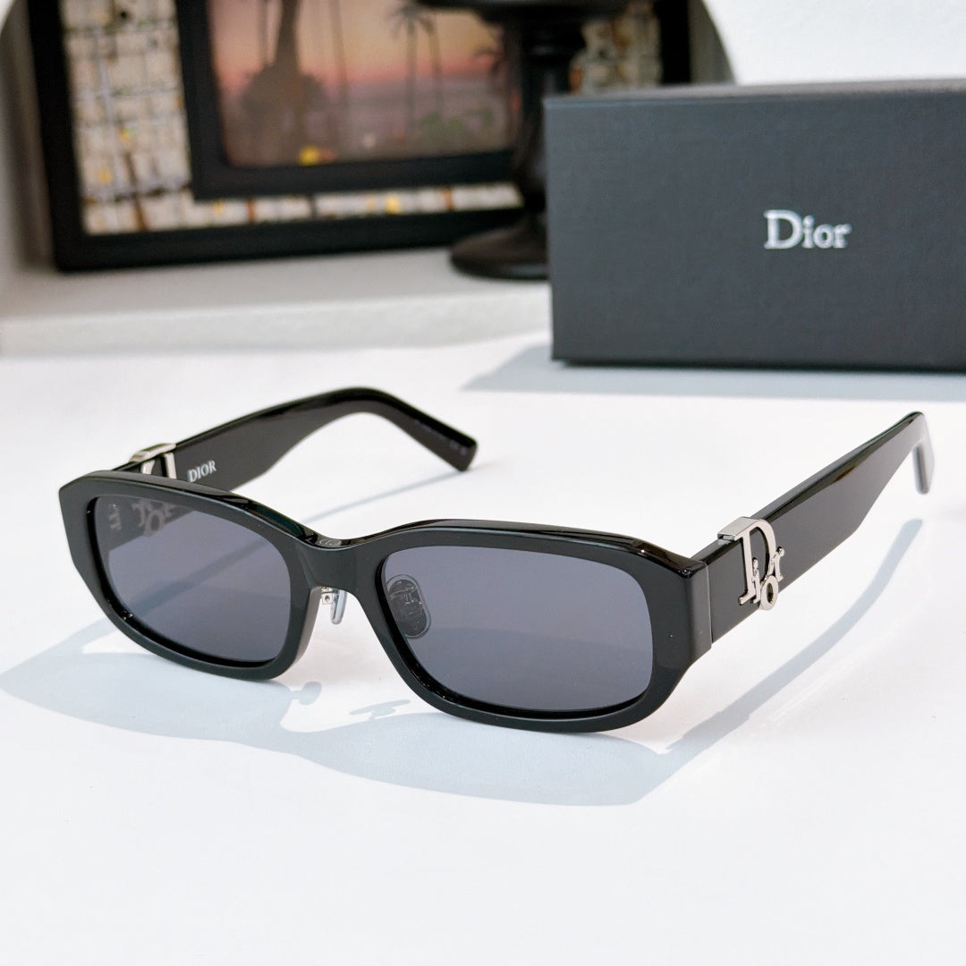 Dior sunglasses with dark frames and smoky gray gradient lenses