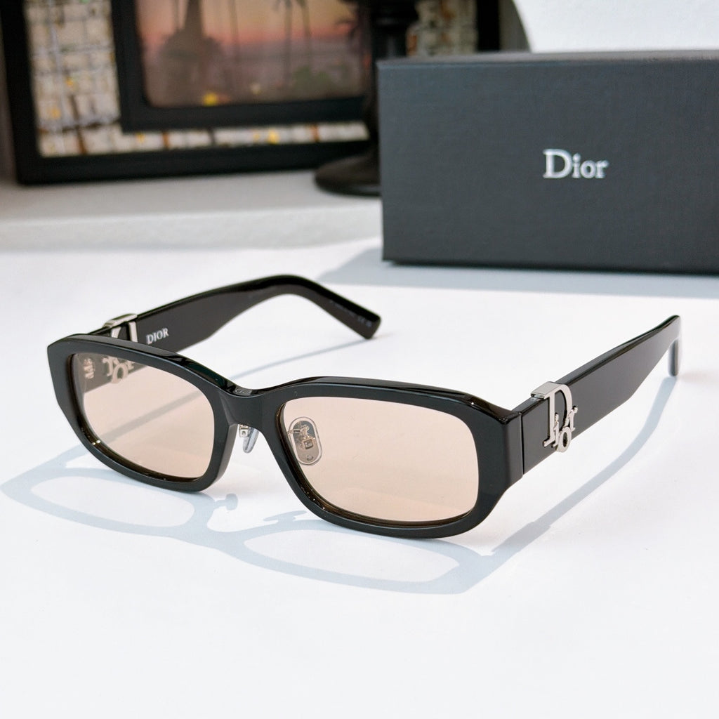 Dior sunglasses with black frames and light tan gradient lenses