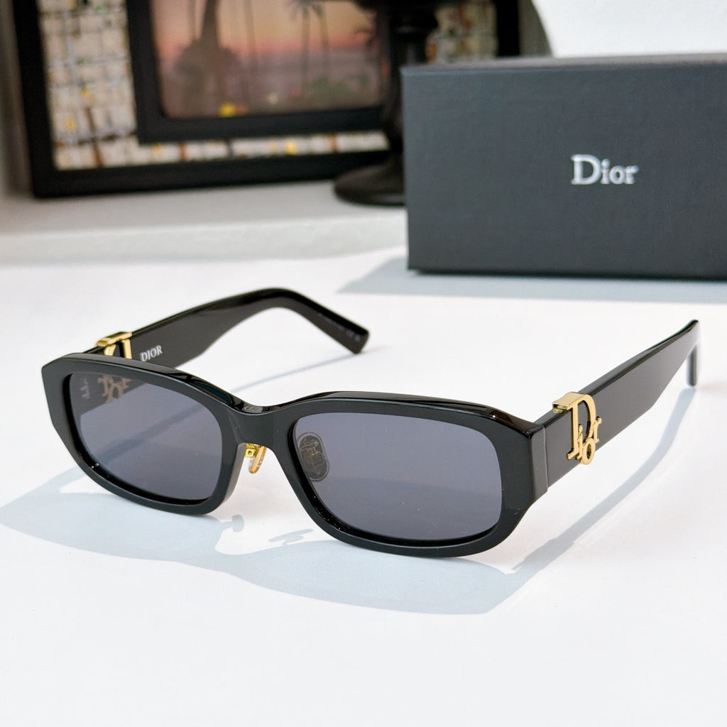 Dior sunglasses with black frames and dark lenses with gold accents