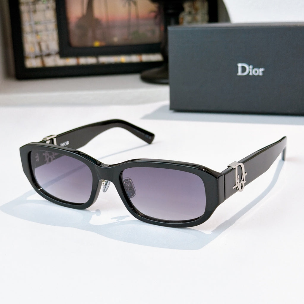 Dior sunglasses with black frames and purple-tinted gradient lenses