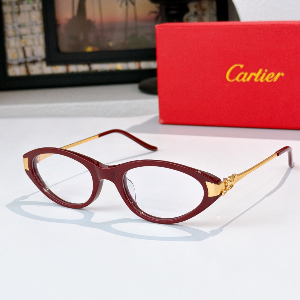 Cartier eyeglasses, burgundy frames, clear lenses, gold temple detail