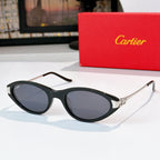 Cartier sunglasses, black frames, tinted lenses, gold temple accents