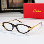 Cartier eyeglasses, tortoiseshell frames, clear lenses, gold temple detail