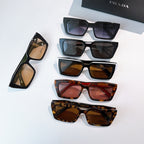 Assorted square sunglasses laid out, including black, blue, brown, and tortoise frames