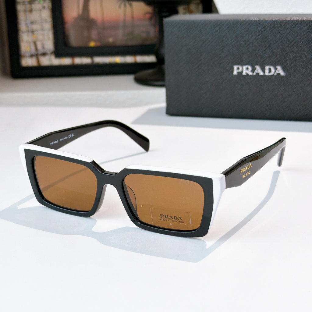 Black square sunglasses with brown-tinted lenses and Prada logo on front and temple