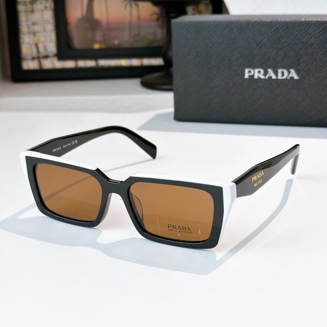 Black square sunglasses with brown-tinted lenses and Prada logo on front and temple