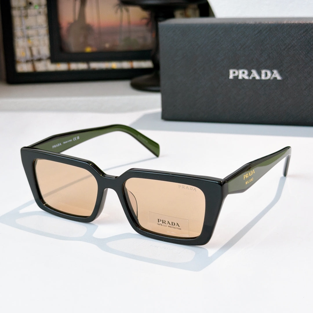 Black square sunglasses with tan lenses and green-accent temple, Prada logo
