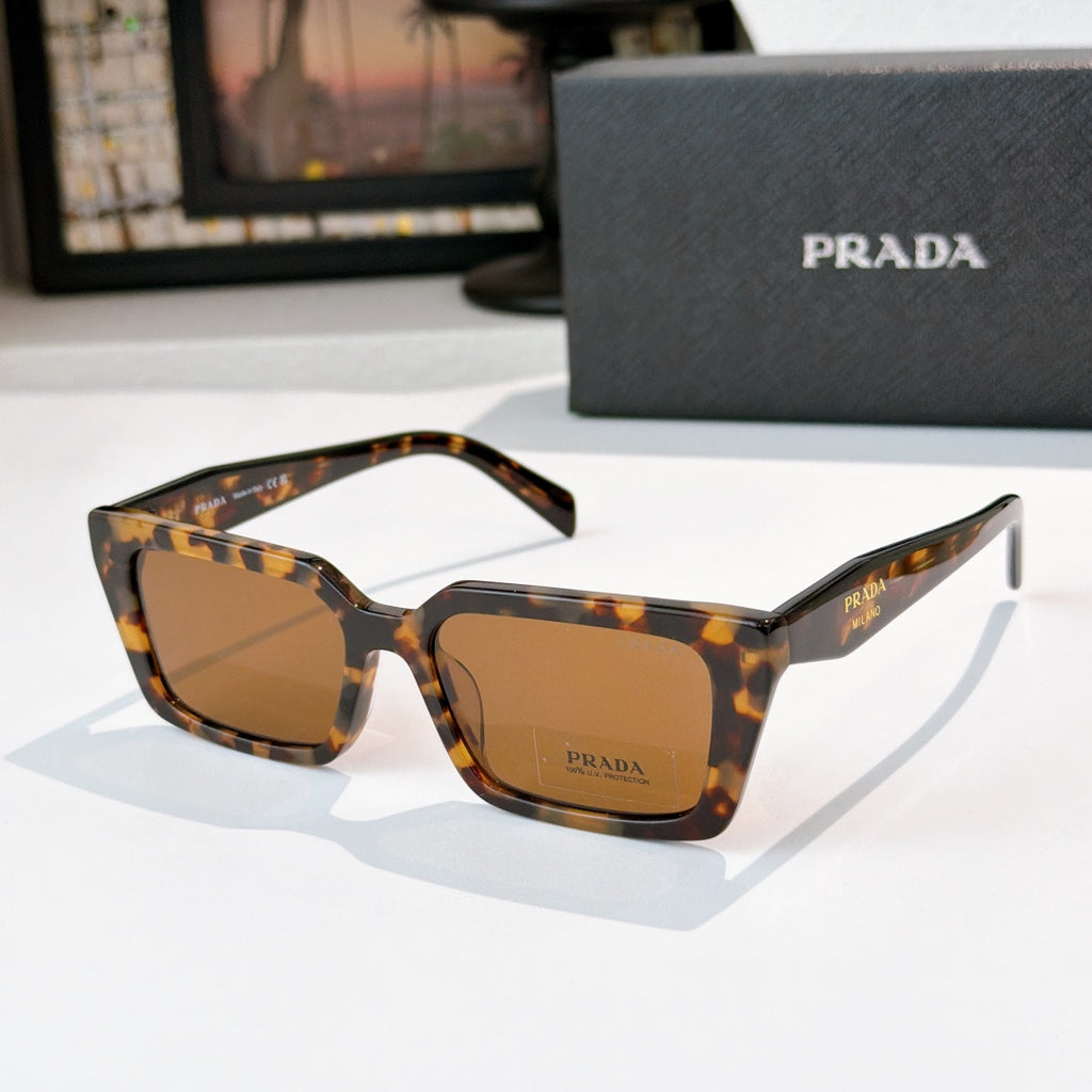 Tortoise square sunglasses with amber lenses and Prada logo on front and temple