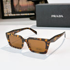 Tortoise square sunglasses with amber lenses and Prada logo on front and temple