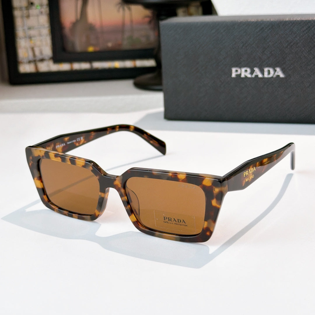 Tortoise square sunglasses with amber lenses and Prada logo on front and temple