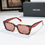 Tortoise and red square sunglasses with amber lenses and Prada logo on temple