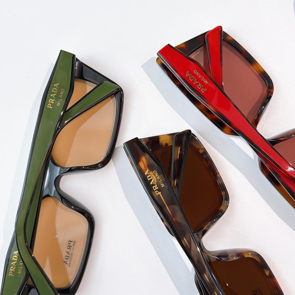 Assorted square sunglasses with green, red, and tortoise frames, Prada logos
