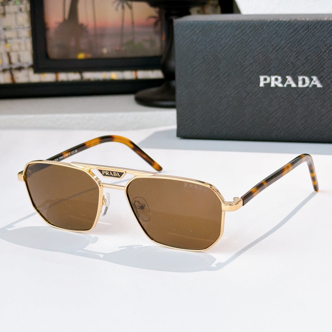 Prada sunglasses with brown lenses and tortoiseshell temples, gold-tone frame